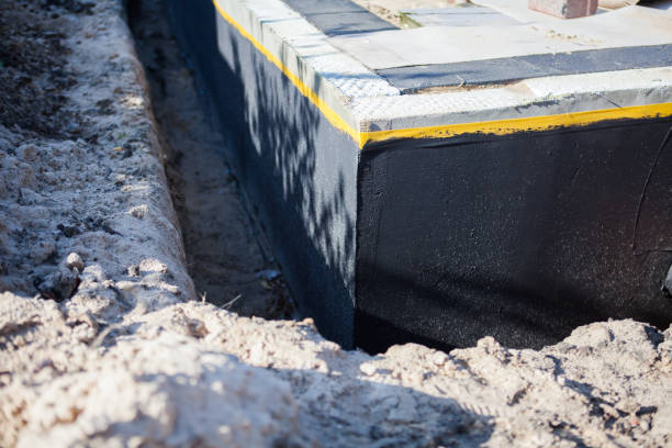 Professional Exterior Waterproofing technician working in Aurora, MN